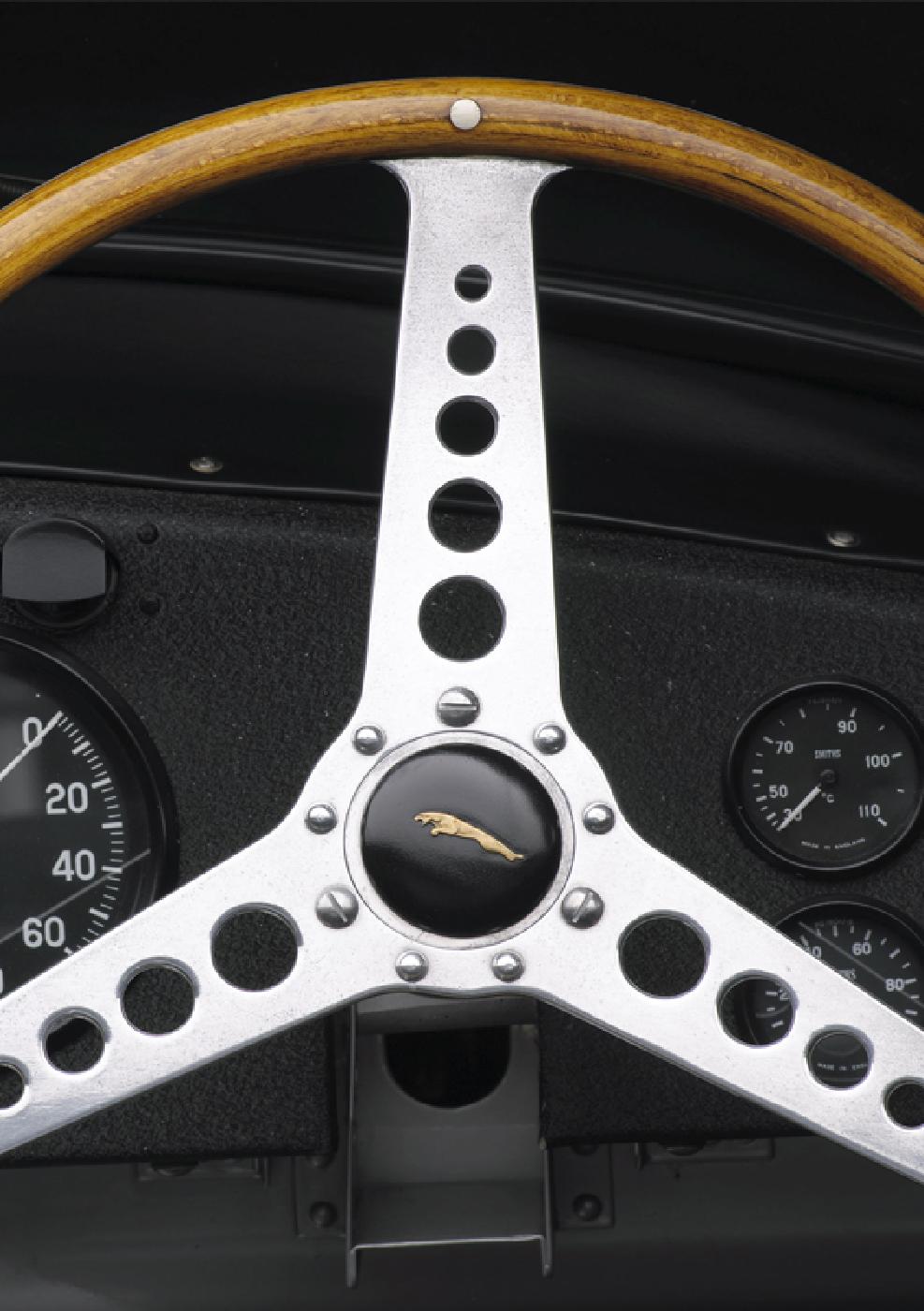                             The Jaguar’s signature three-spoke steering wheel
