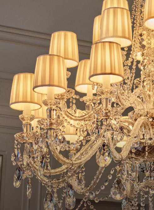 Crystal chandelier with cloth shades.